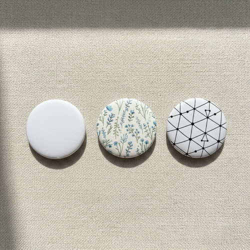 Multiple 32mm customisable button badges on beige background